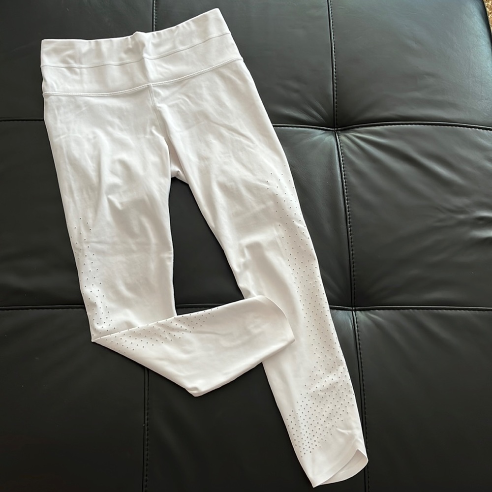 Athleta legging with laser cut holes on the side; similar to Salutation Stash